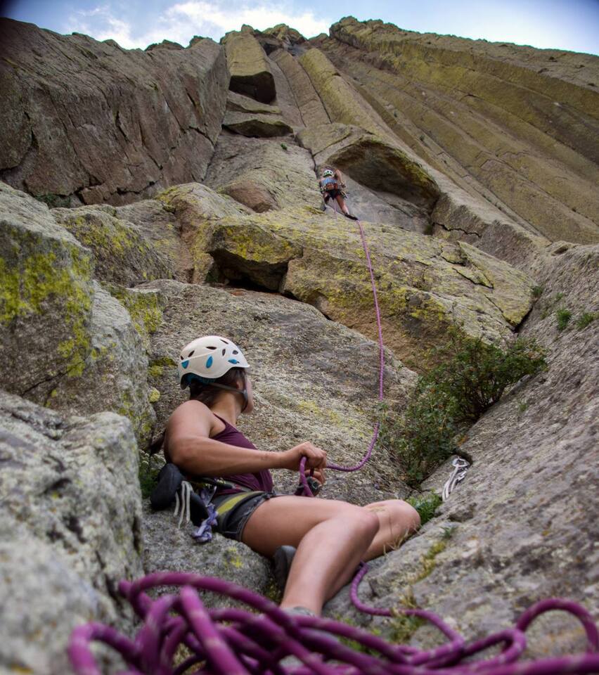 Belayer gazing up at climber